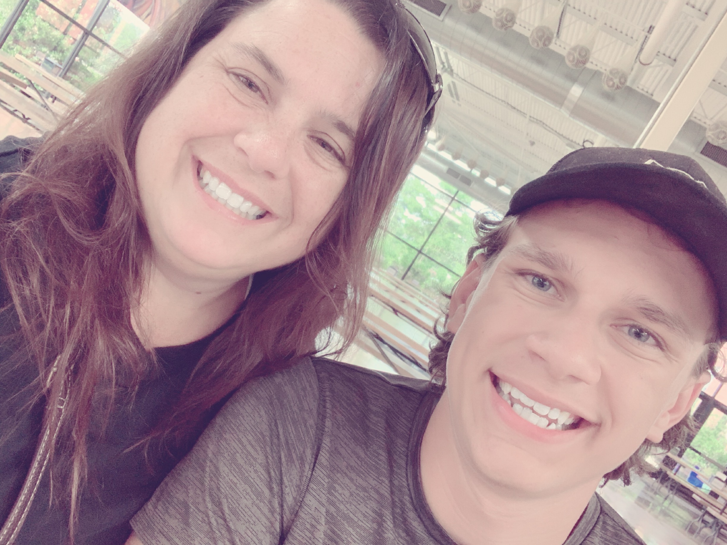 Matthew and Becky sitting side by side smiling