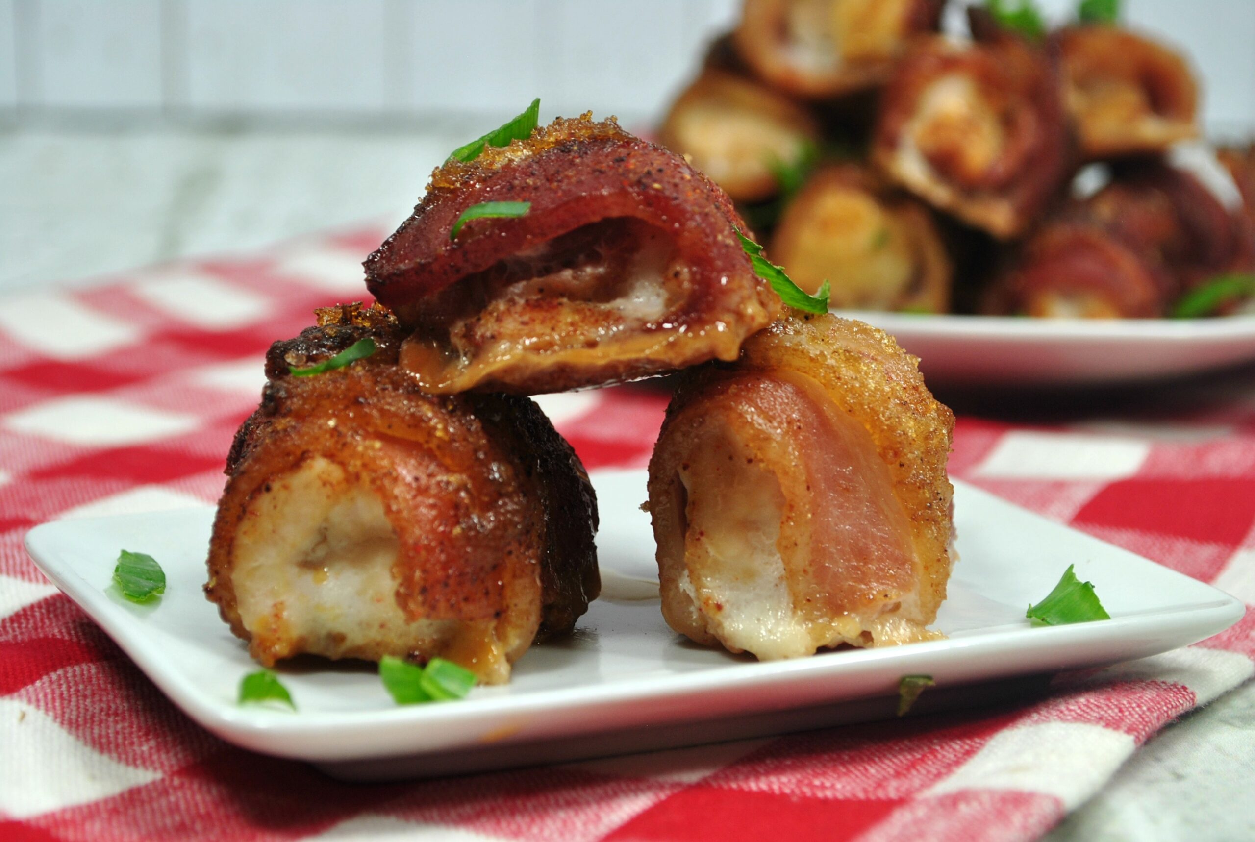 Bacon Wrapped Chicken on White Plate on Table